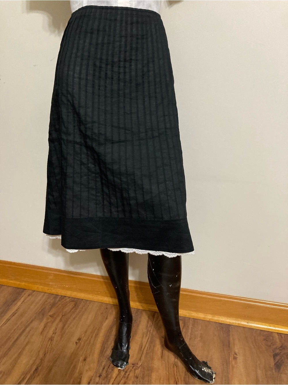 Black A-Line Skirt with Dainty Pleats and a Delicate Lace Hem.
Item# SSsk11